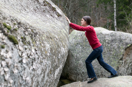 Growing business - pushing a boulder up a hill
